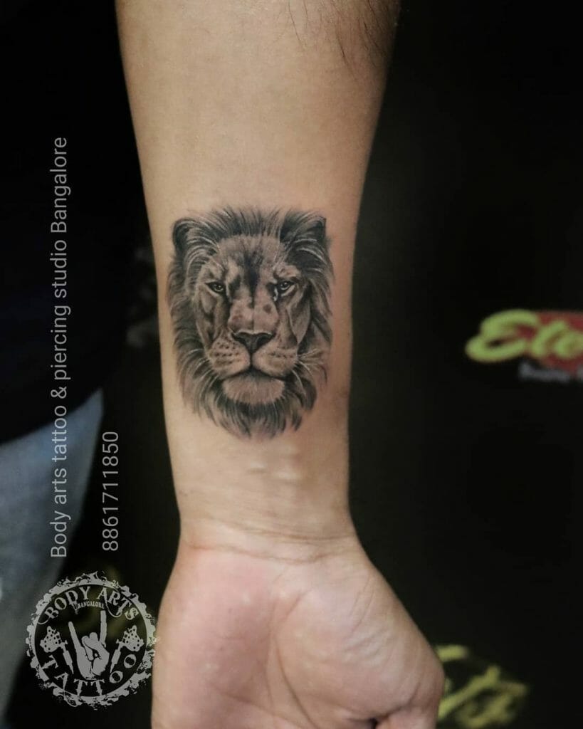 Cute And Bold Lion Tattoo On Forearm In Black