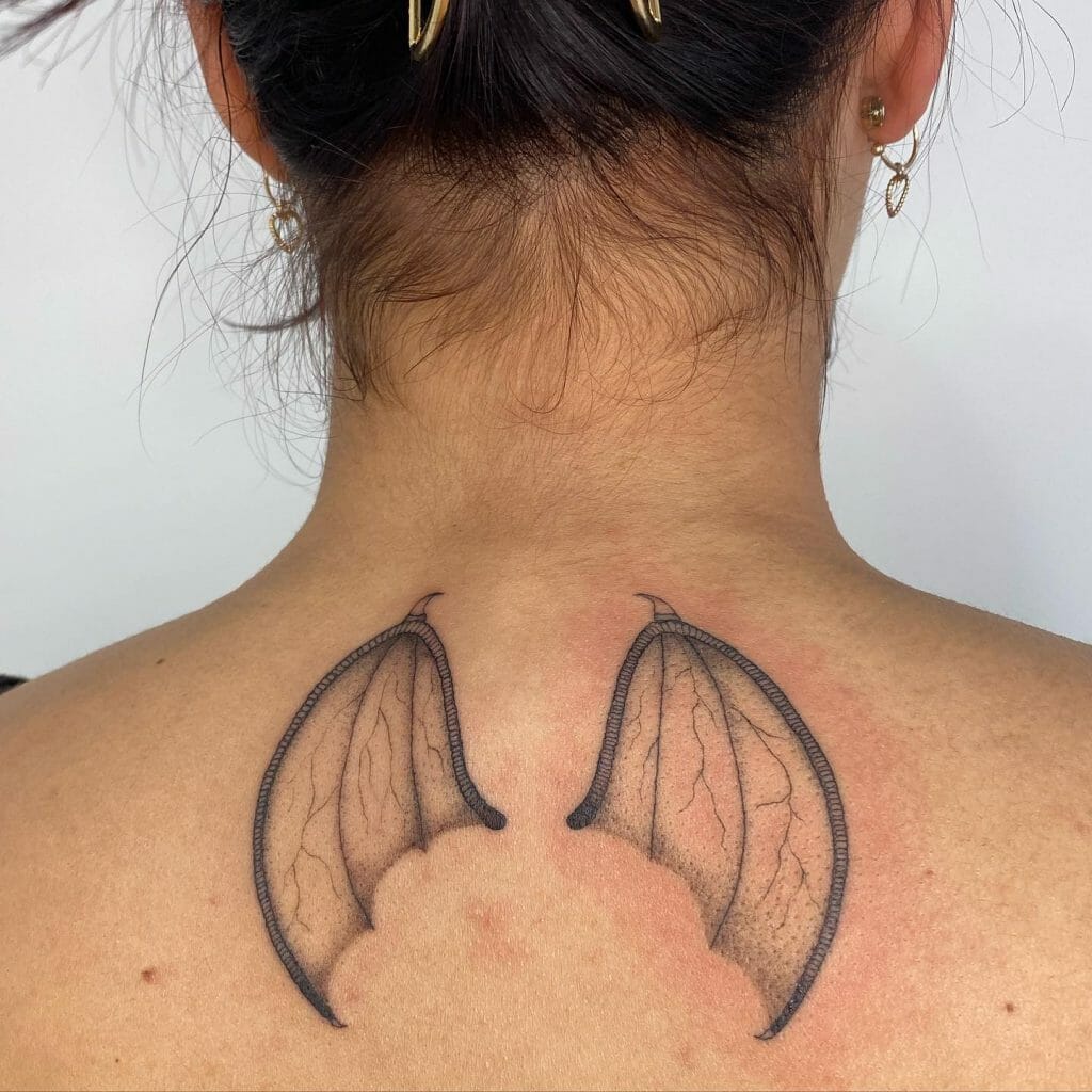 Demon Wings On The Neck Tattoo For Women