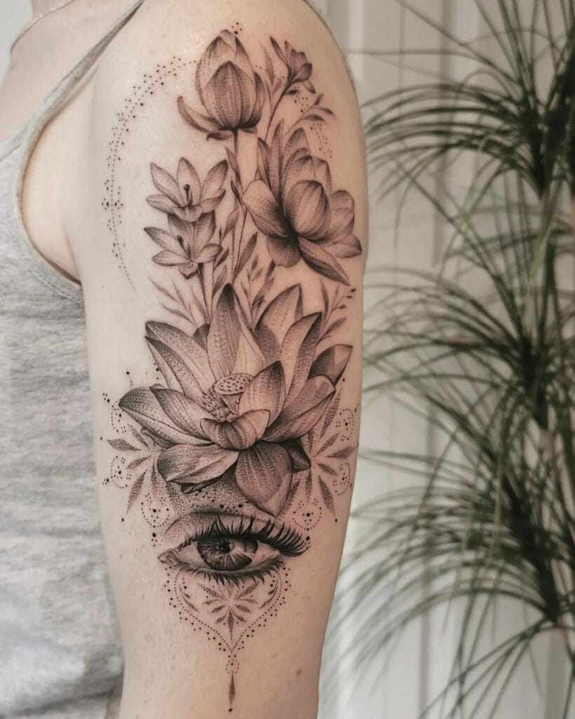 Finely Detailed Flowers With Eye Half Sleeve Tattoo