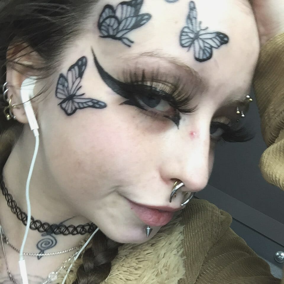 Geometric Butterfly Face Tattoo