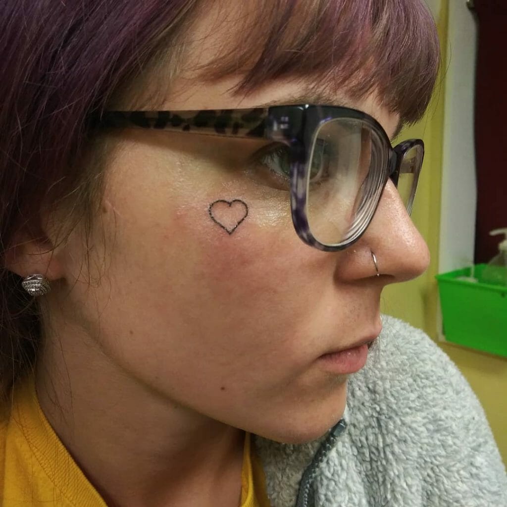 Heart outline Tattoo on Face
