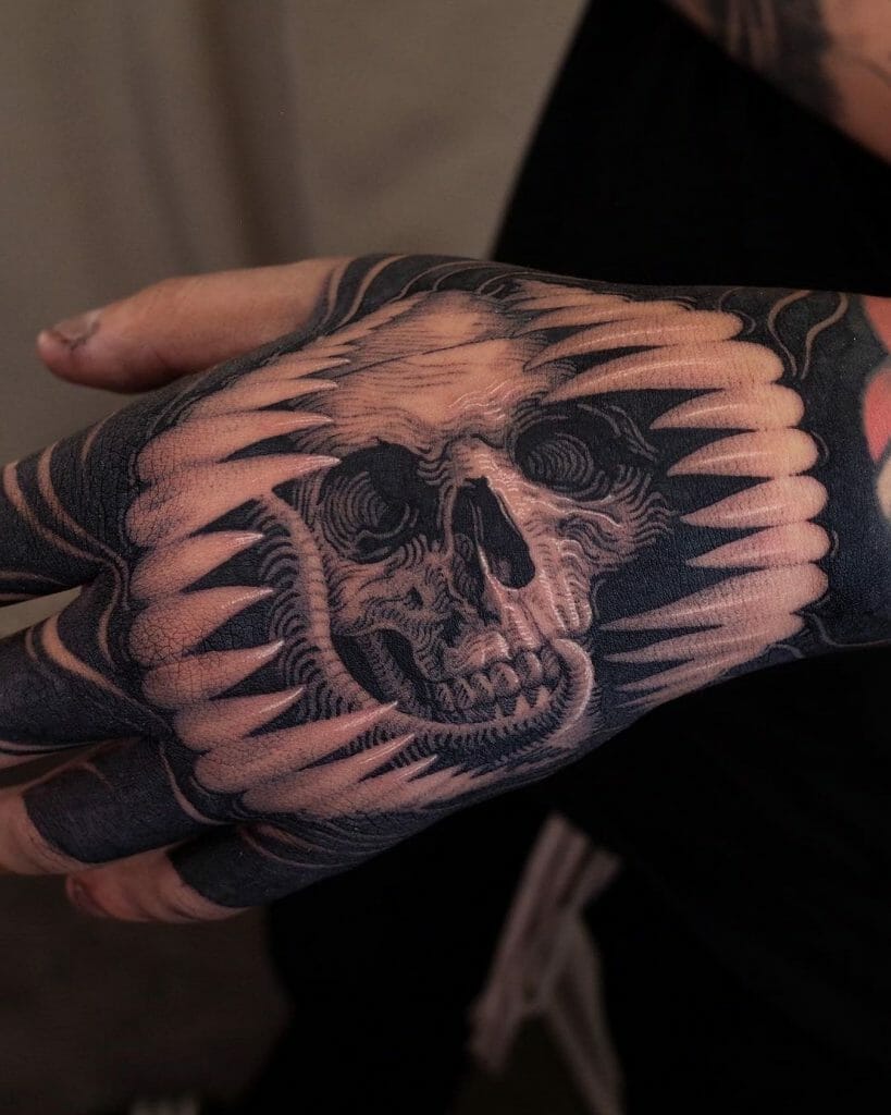 Mens Skull Hand Tattoo