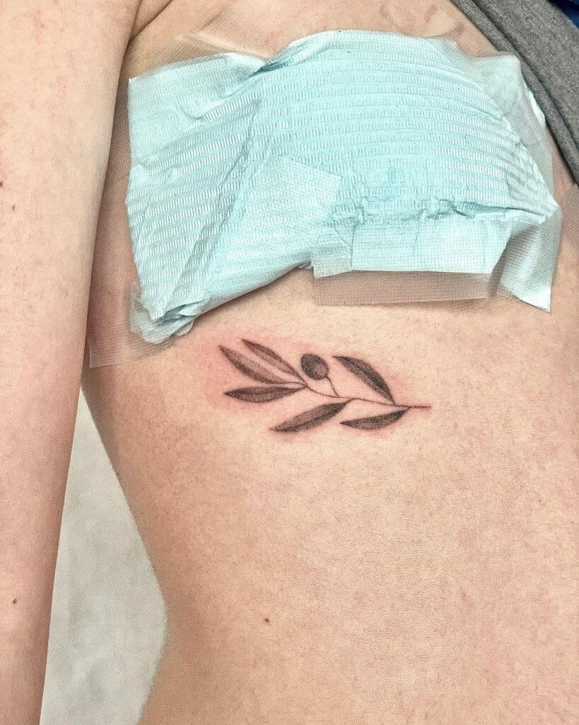 Minimalist Olive Branch Rib Tattoo