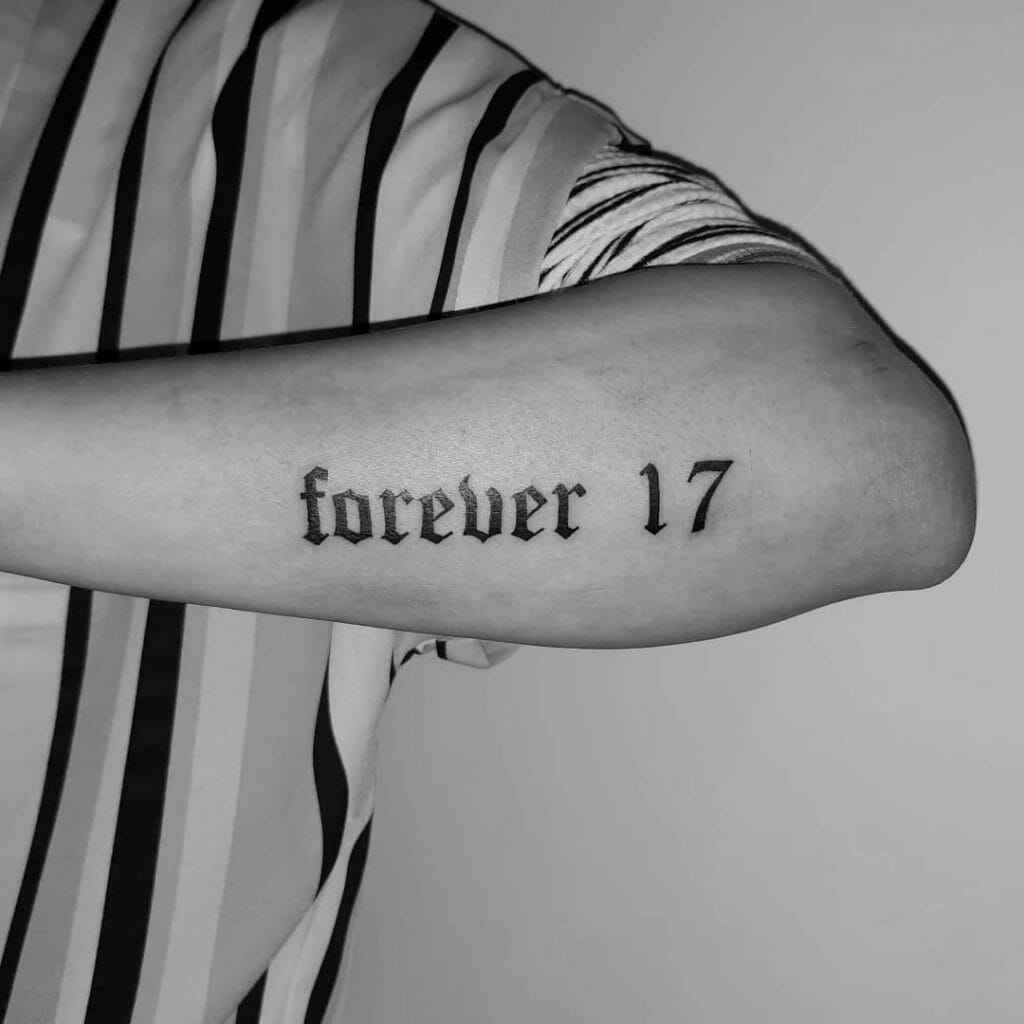 Old English Numbers Tattoo On Forearm