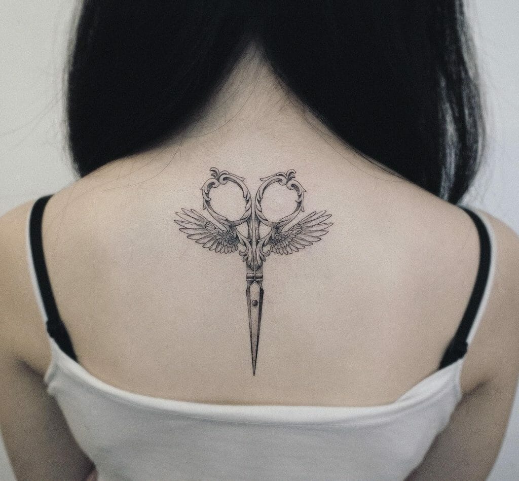 Ornate Angel Wings and Scissors Upper Back Tattoo Designs