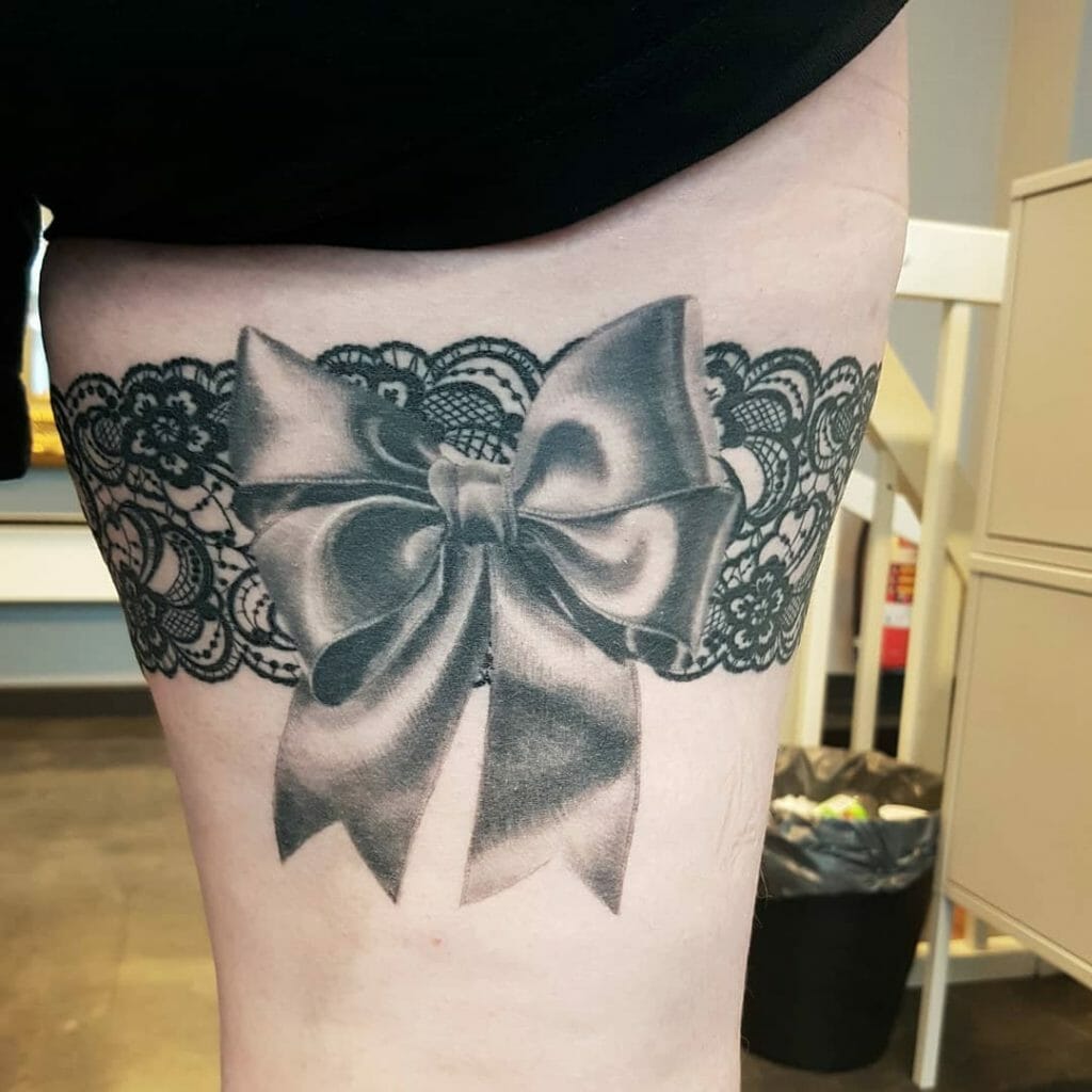 Silk Bow And Ribbon Tattoo On Front Thigh