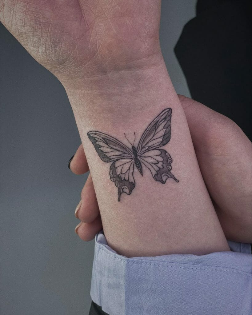 Simple Black Butterfly Tattoo On Wrist