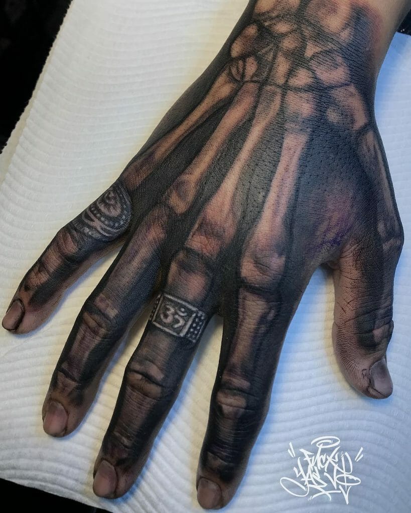 Skeleton Hand Tattoo With Ring Design