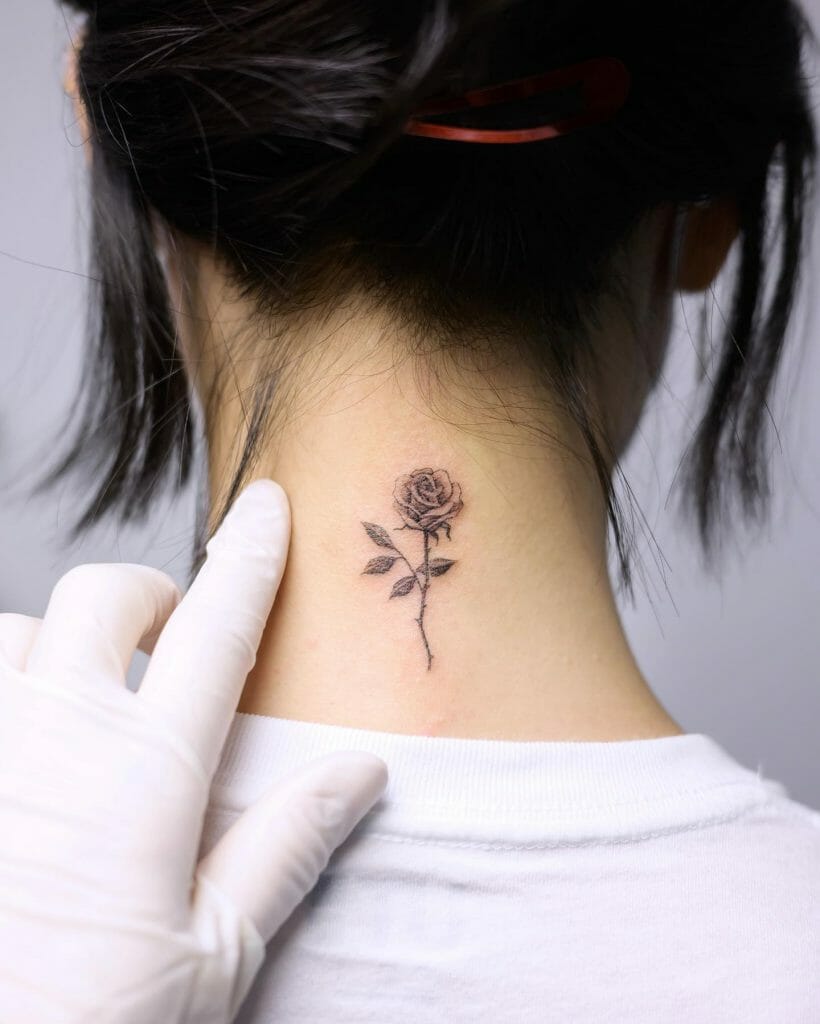 Small Flower Tattoo On The Neck
