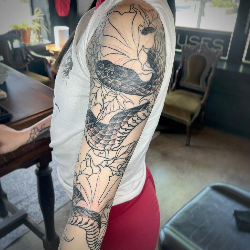 Snake And Flowers Spaced Out Tattoo Sleeve
