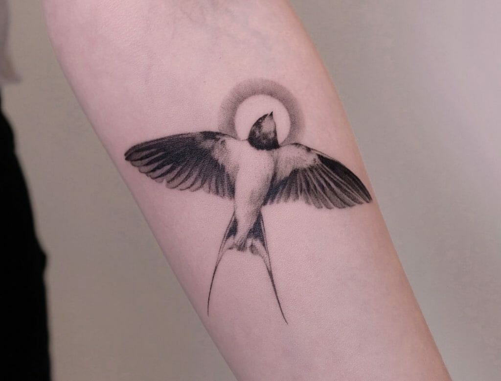 Swallow Hand Tattoo With A Halo