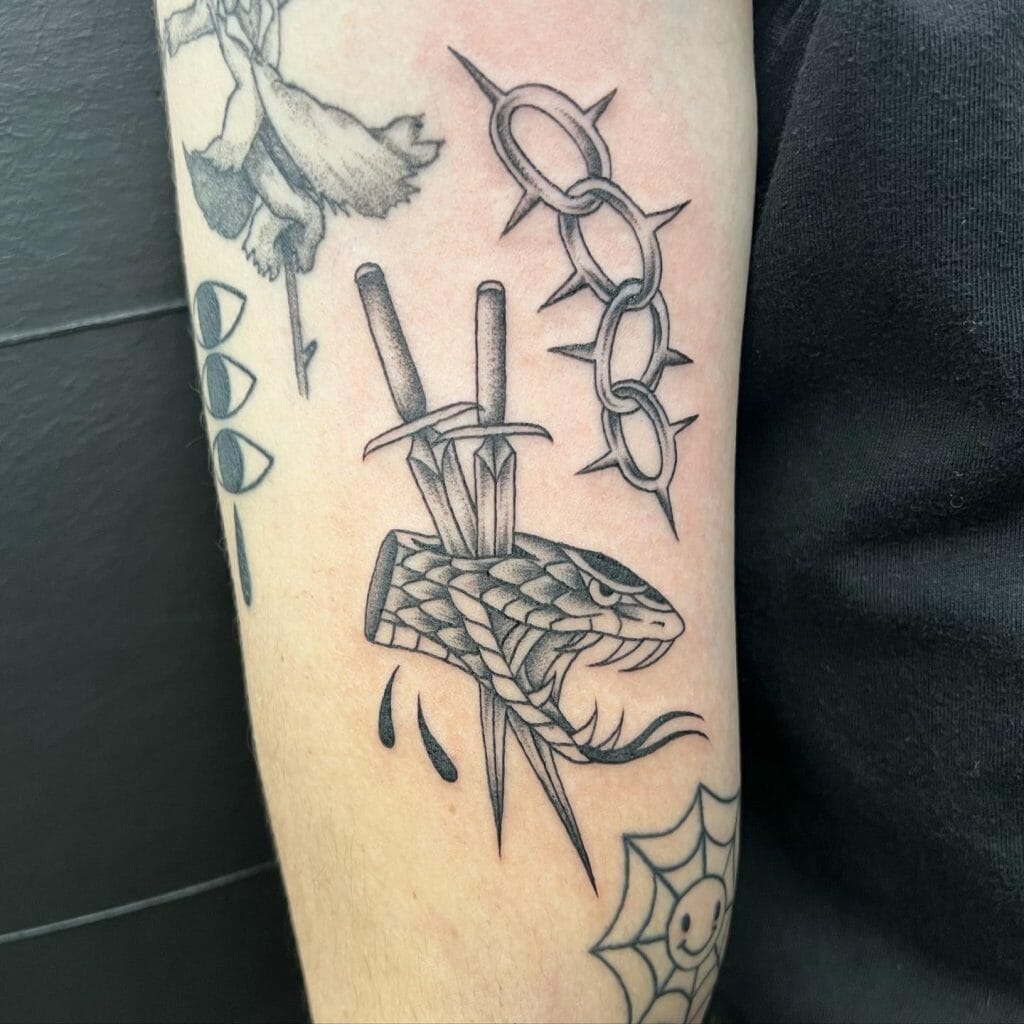 Two Dagger Passing Through The Snake Tattoo