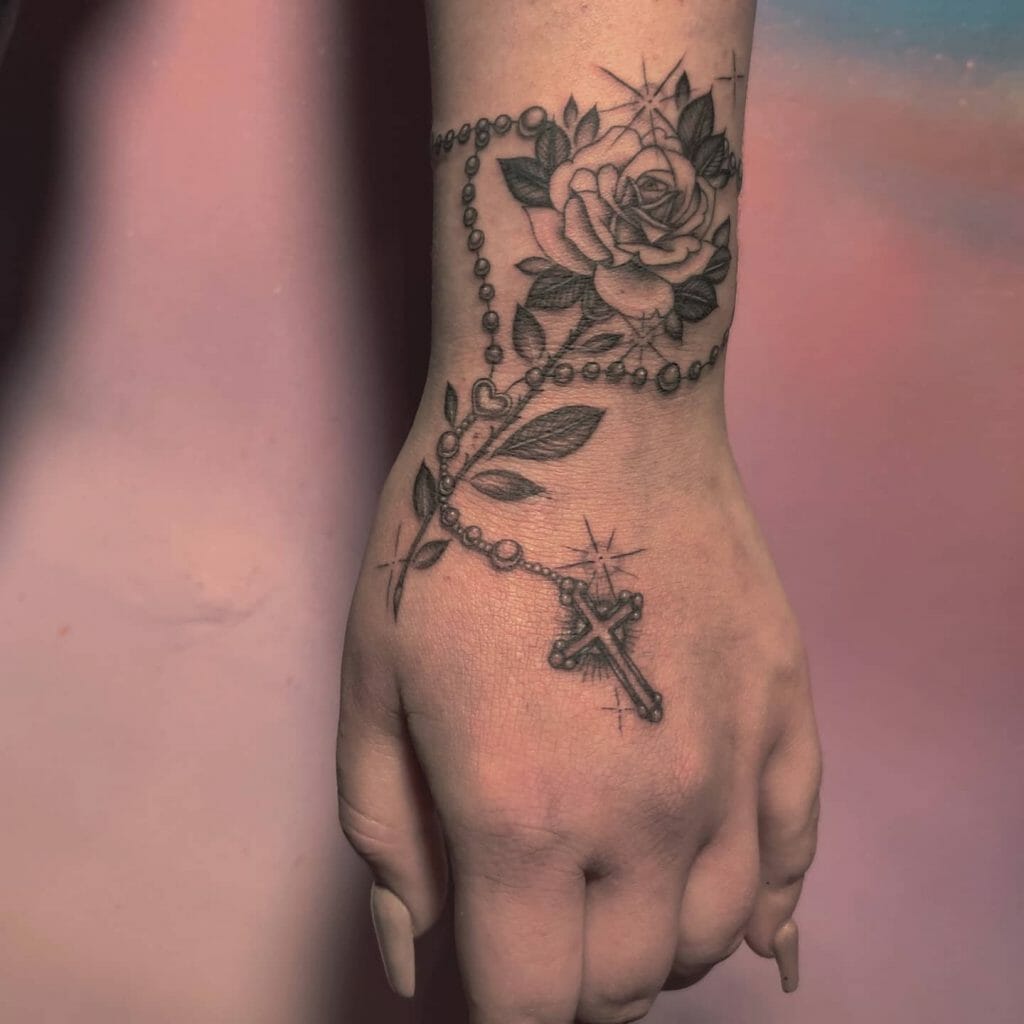 Wrist Rosary Tattoo On Hand With Rose