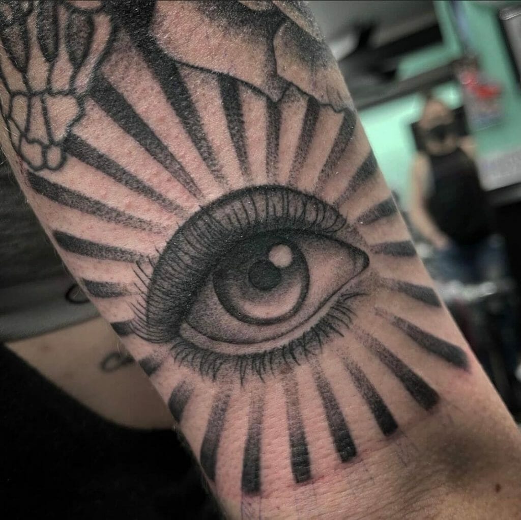 Sun Rays And Eye Tattoo