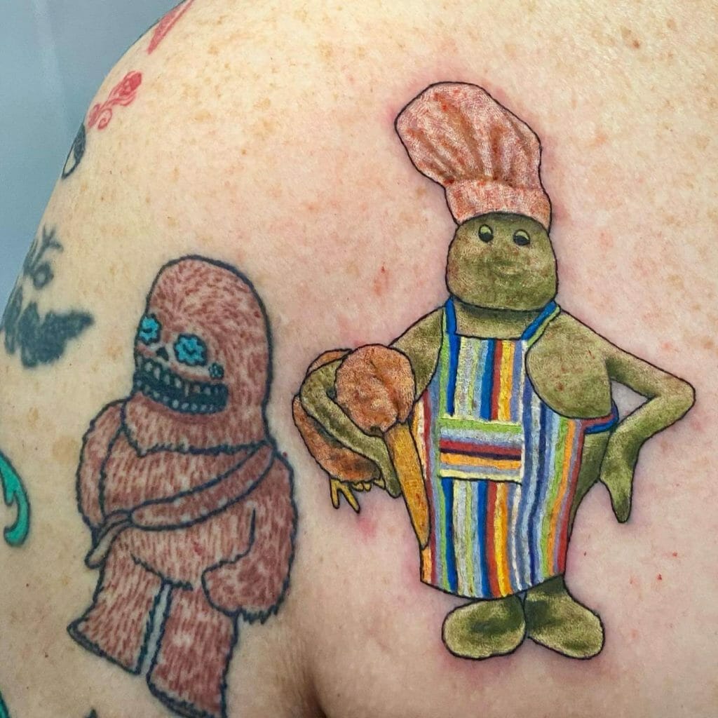  Smiling Small Chef Tattoo On Shoulder
