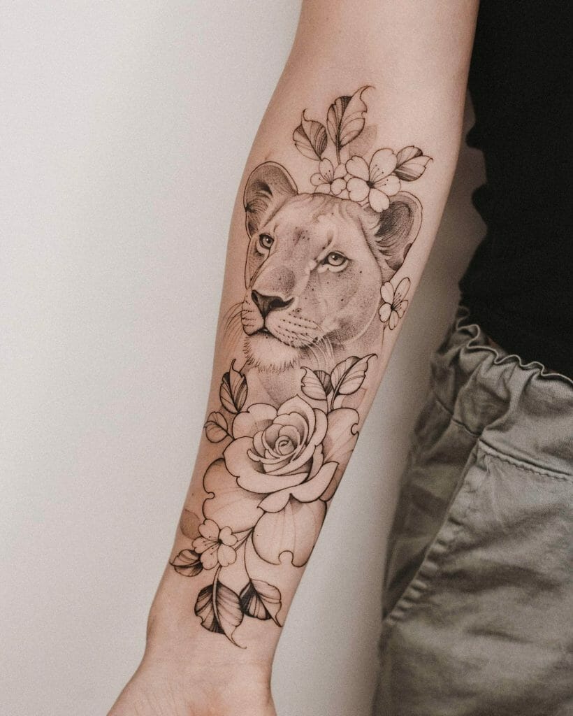 Floral-Themed Front Right Arm Lioness Tattoo Idea