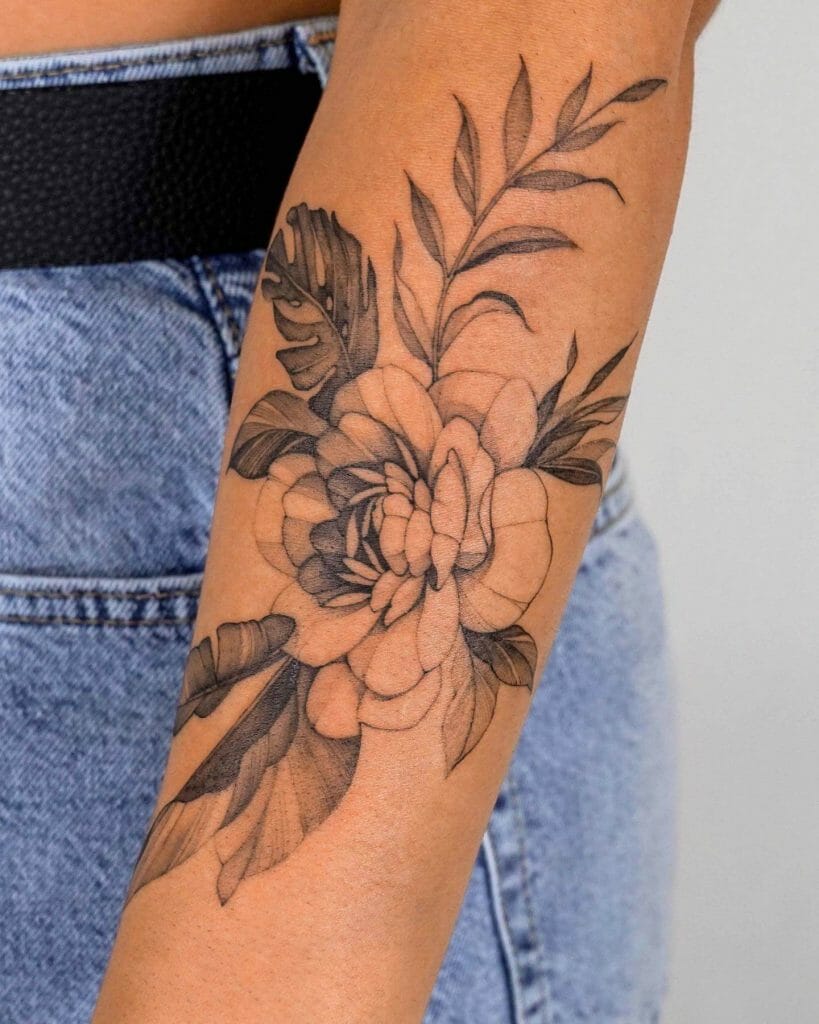 Stunning Tropical Arm Flower Tattoo In Black