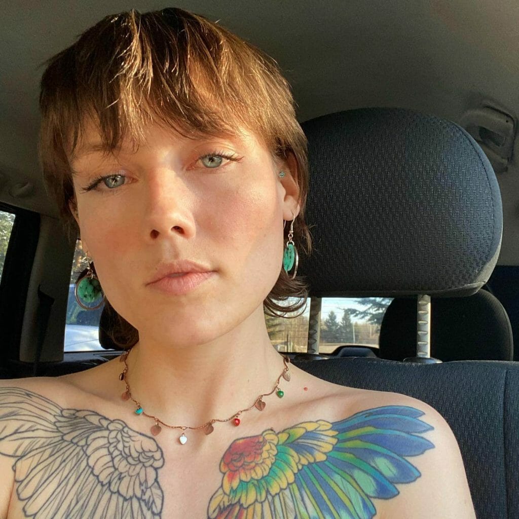 The Dichotomy Of Both Colorful And Black Wings Tattoos