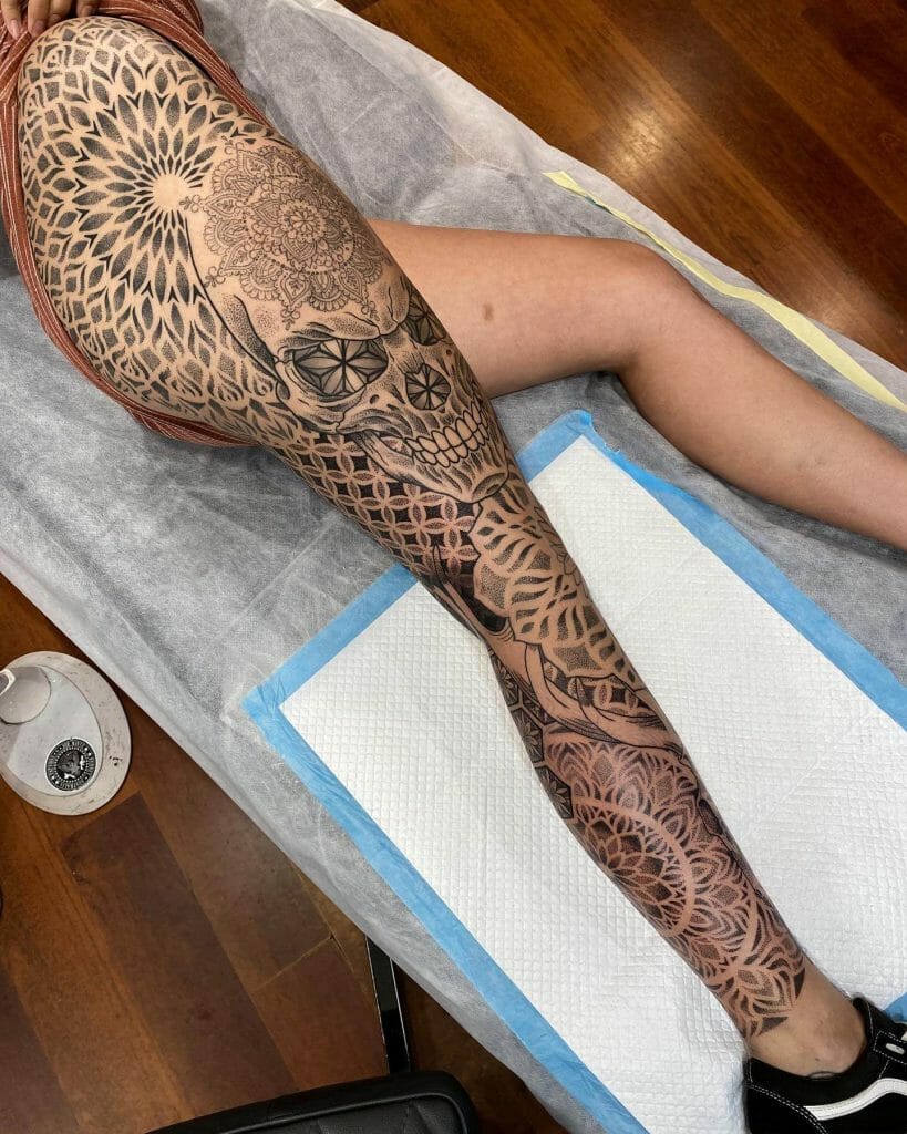 Women Leg Sleeve Tattoo With Skull Motif