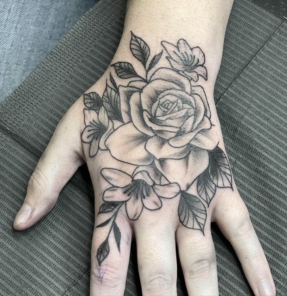  Beautiful Embossed Black Rose Hand Tattoo