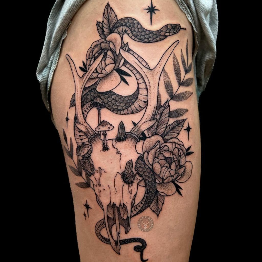 Large Snake Hip Tattoo With Flowers And Animal Skull