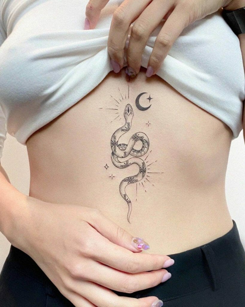 Snake and Moon Sternum Tattoo