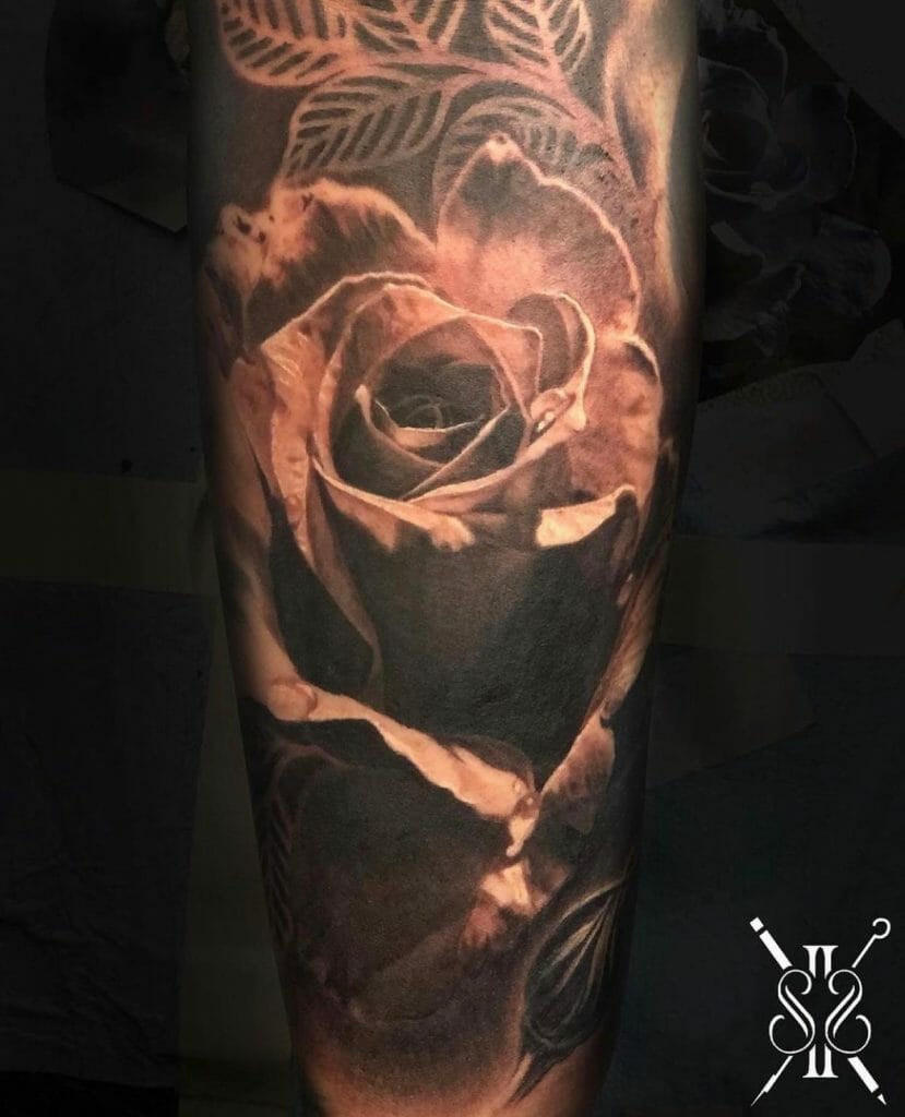 A Rose Flower Tattoo With Intricate Shading