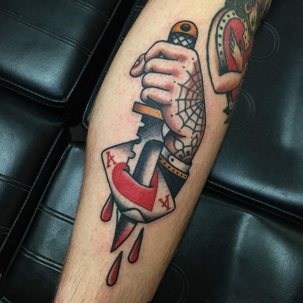 A Tattoo Of A Knife Piercing Through Ace Of Hearts