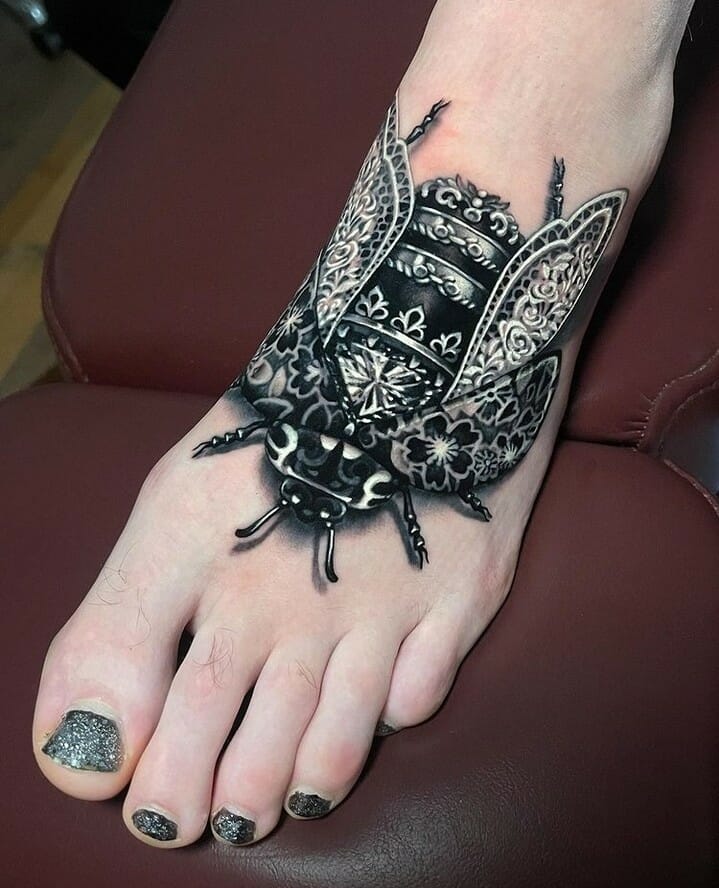 Black Regal Ladybug Tattoo On Foot