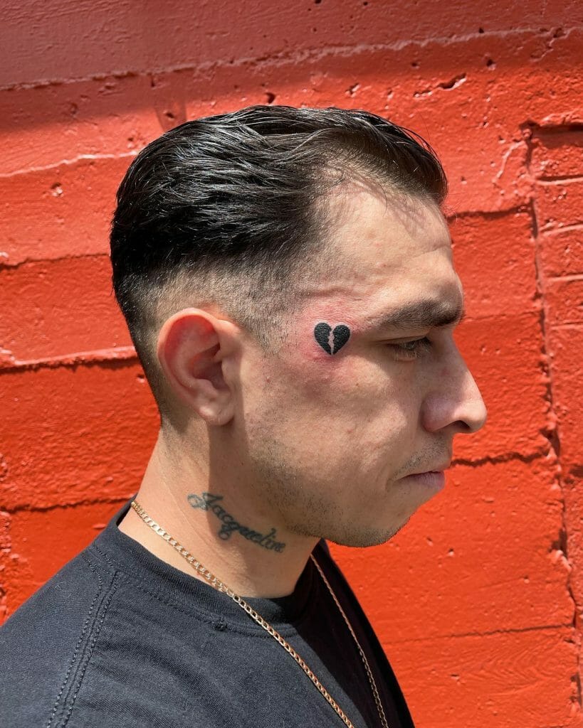 Broken Heart Tattoo On Face