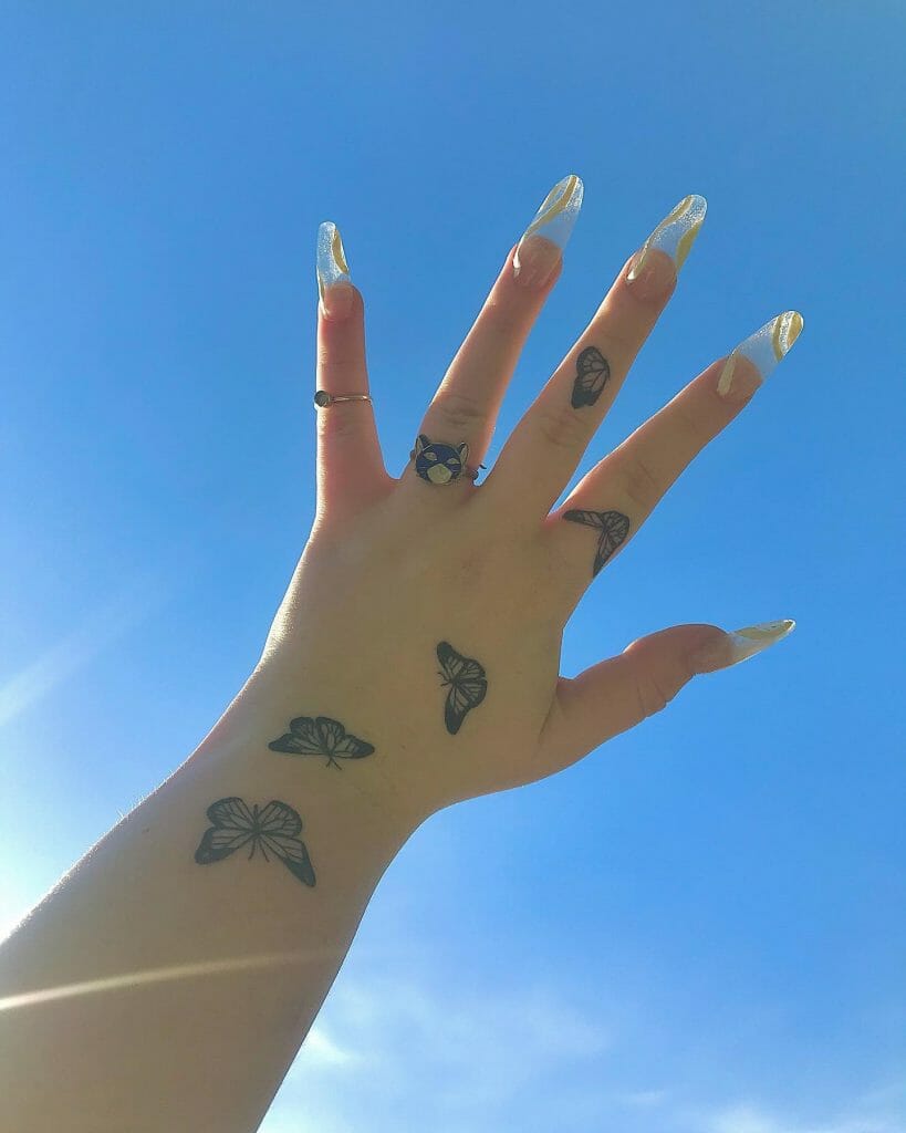 Butterfly Tattoo On Finger