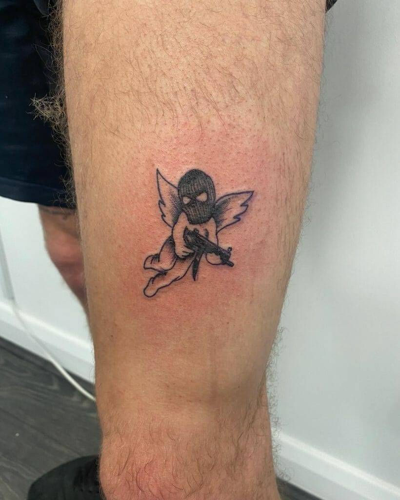 Cherub With Gun Angel Tattoo