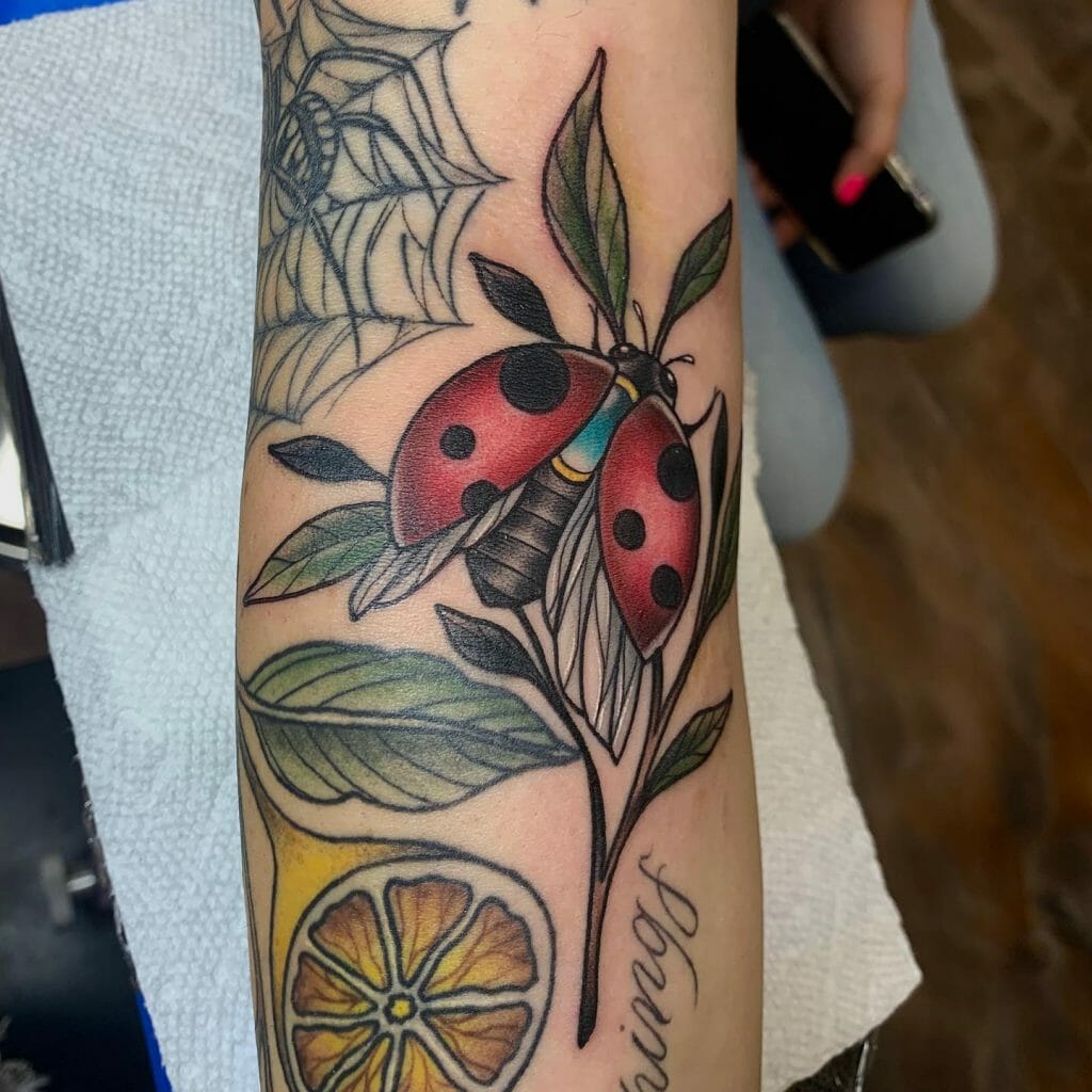 Colorful Ladybug On Twig Tattoo