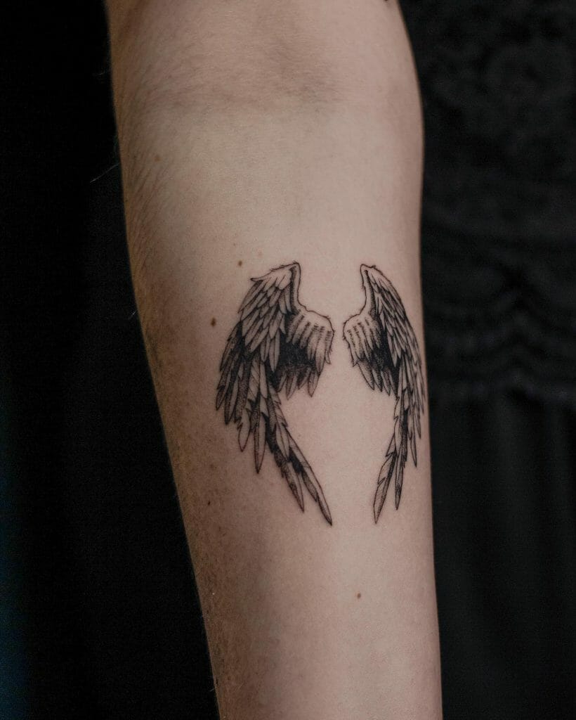 Double Black Ink Wing Tattoo Design