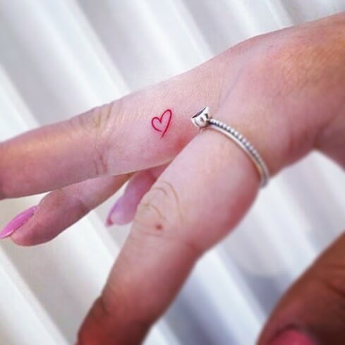 Heart Inner Finger Tattoos