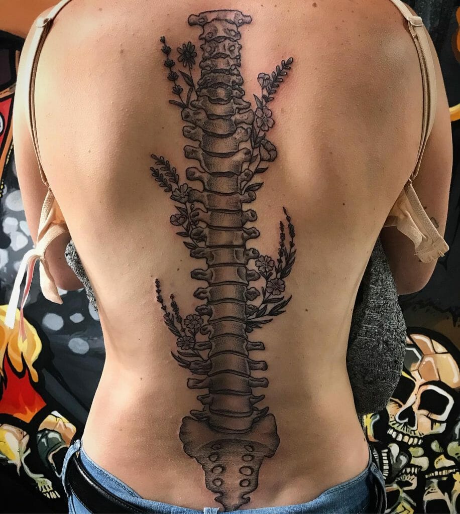 Illustrated Spine Tattoo With Small Flowers