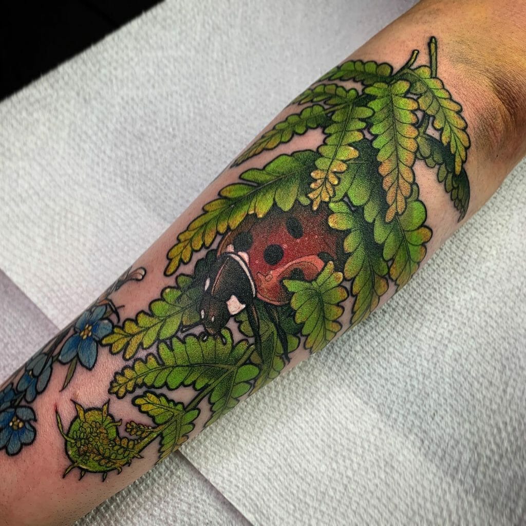 Ladybug Resting In Foliage Tattoo