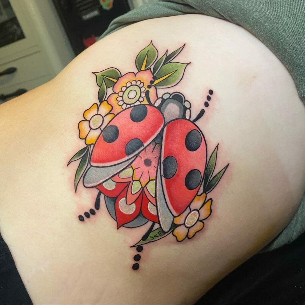 Ladybug Tattoo With Floral Art
