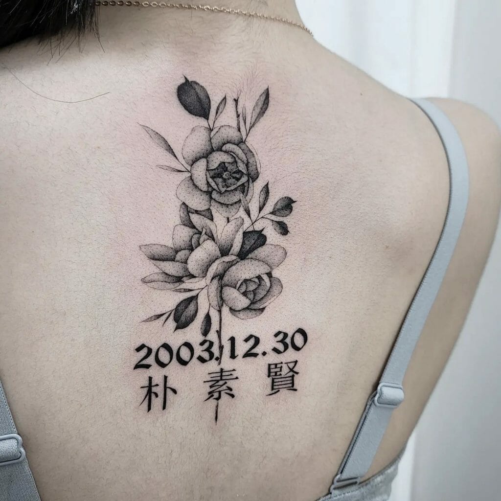 Meaningful Back Flower Tattoo