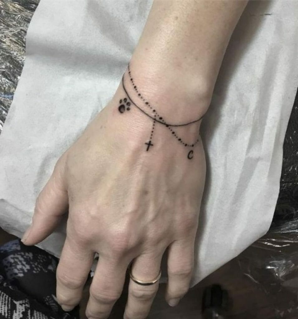 Tiny Rosary Tattoo