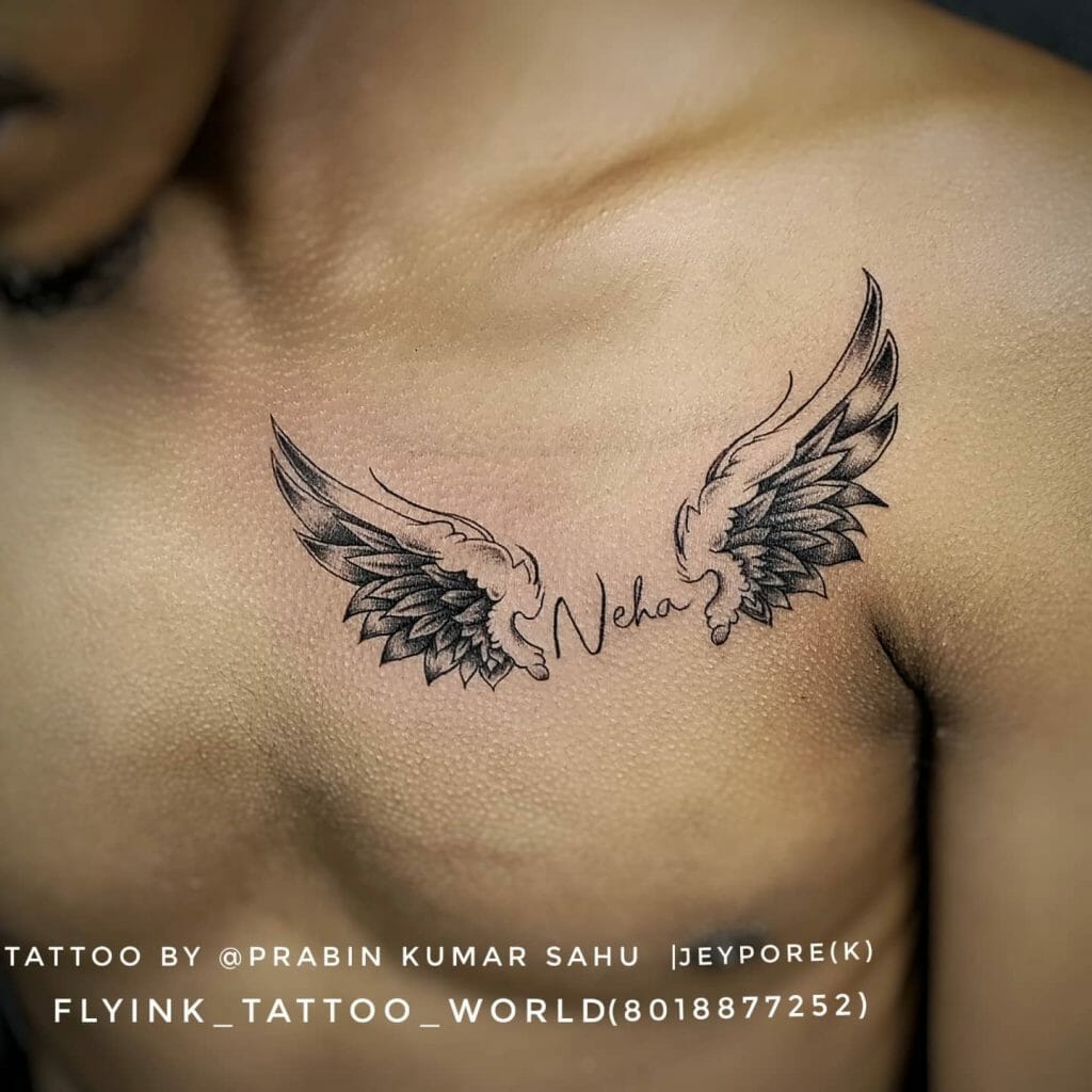 Wings With Name On Chest Tattoos
