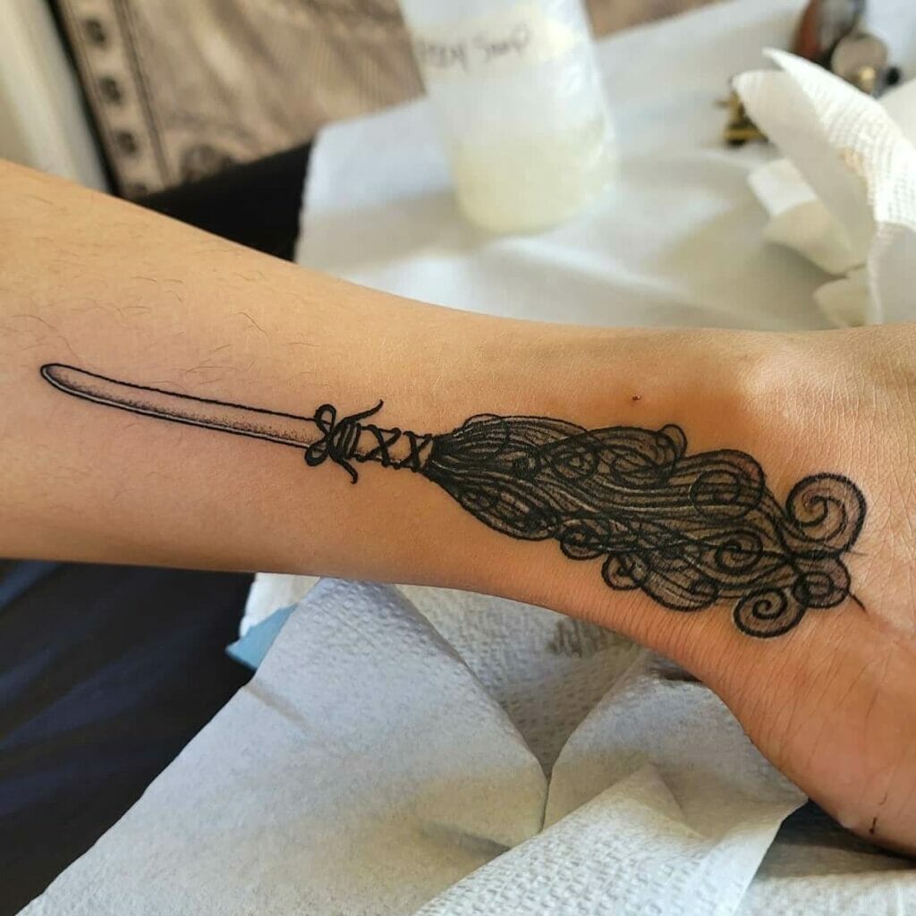 Minimalist Broom Witch Tattoo