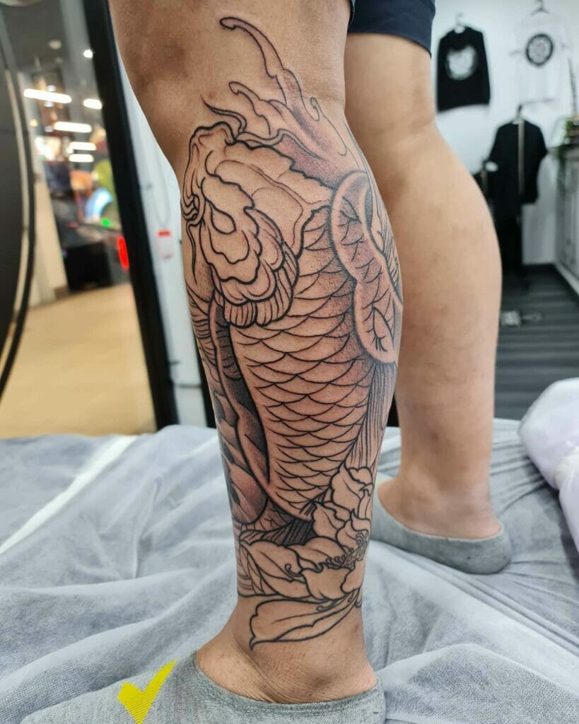  Bright And Bold Koi Fish Leg Tattoo With Lotus Lowers