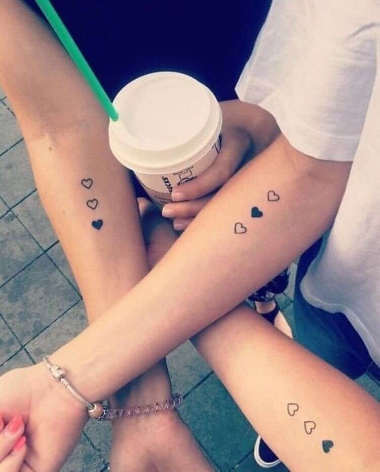 Tattoo With Three Heart Symbols