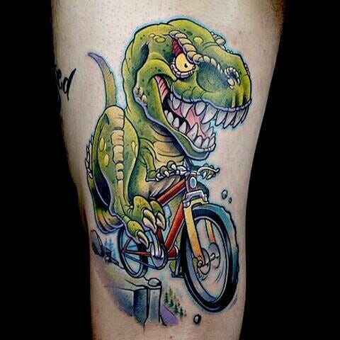 Tattoo Of A Dinosaur On A Mountain Bike