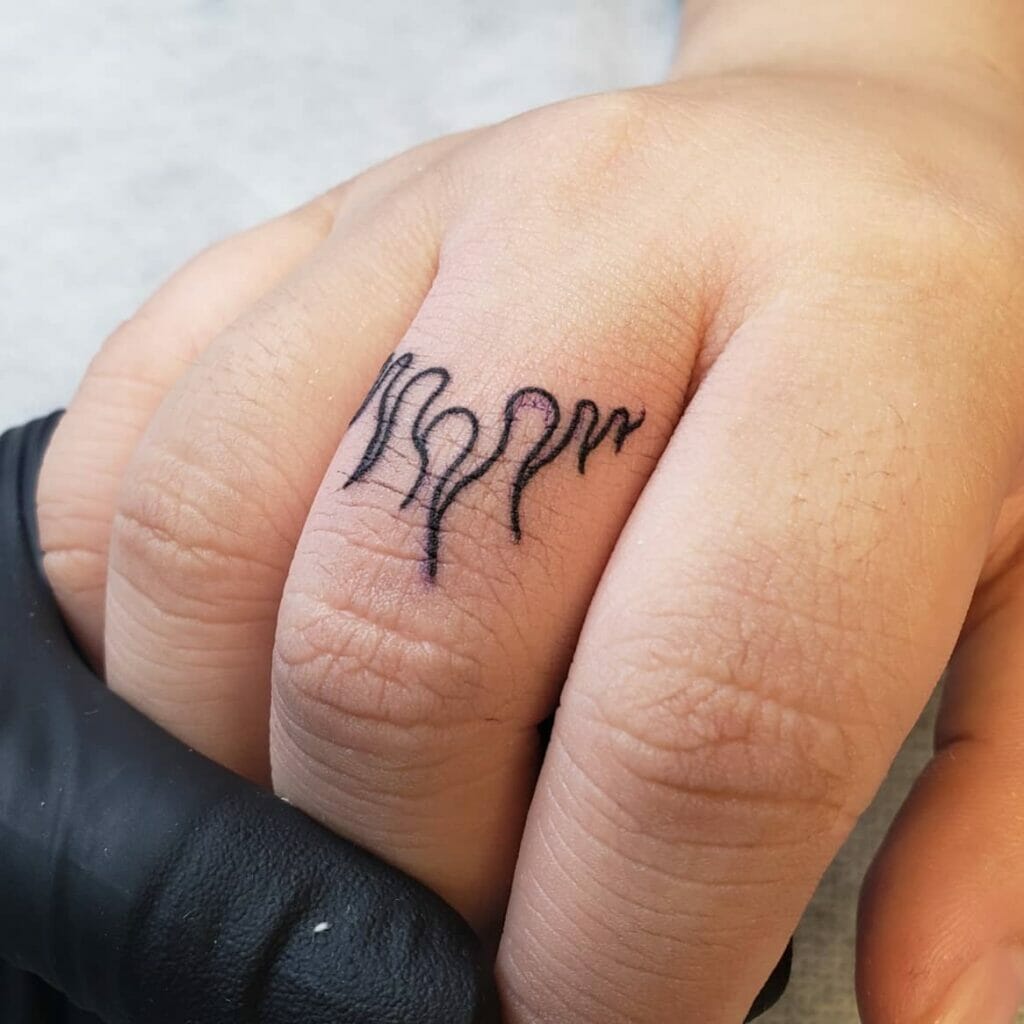 Cute Flame Tattoo On Finger