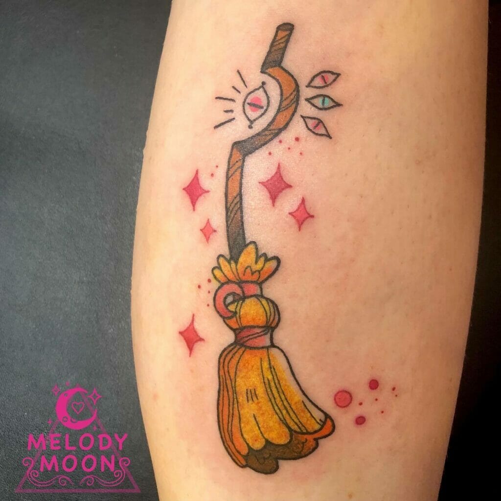 Colorful Broom Tattoo With Lots Of Eyes And Sparkles