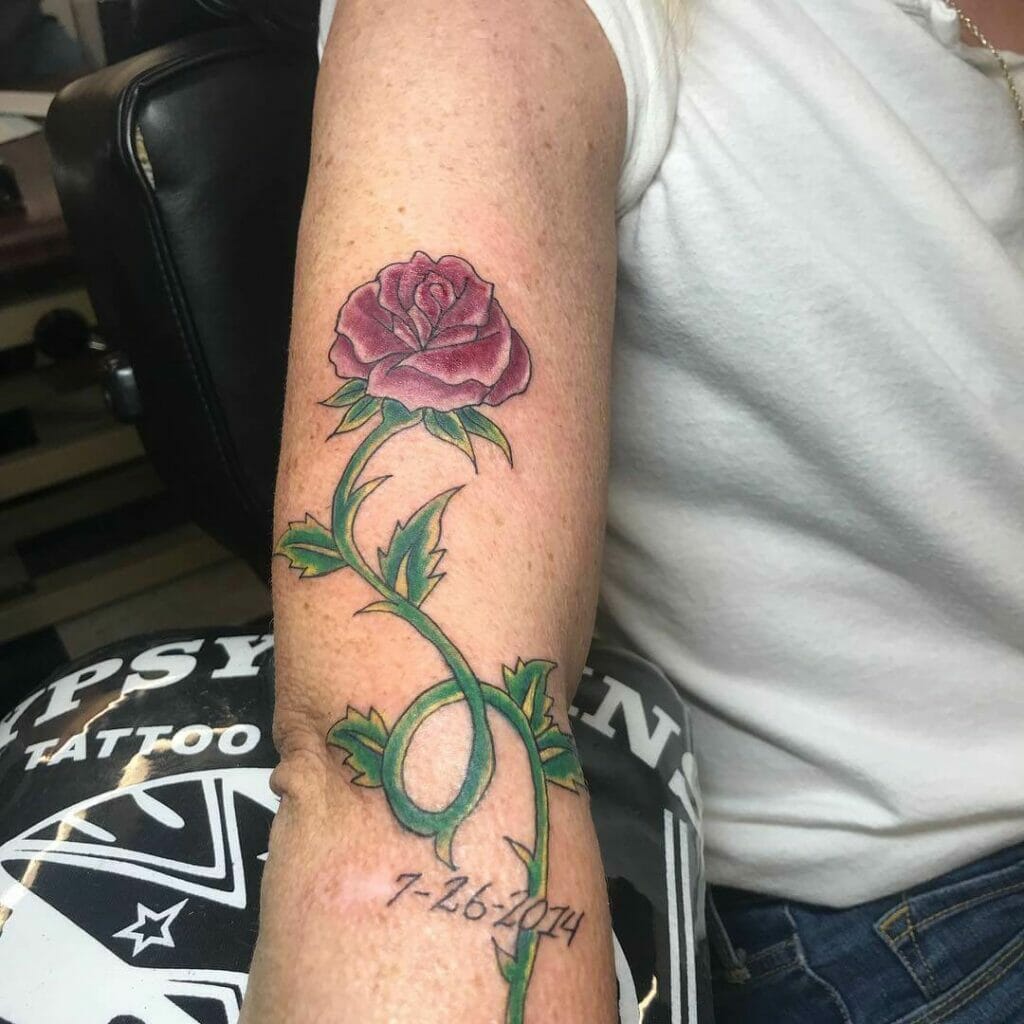 Dark Red Rose Tattoo And Green Stem On Arm