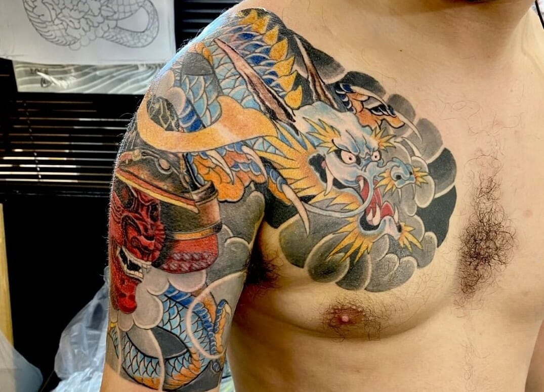 Black Ink Japanese Tattoo On Man Right Chest
