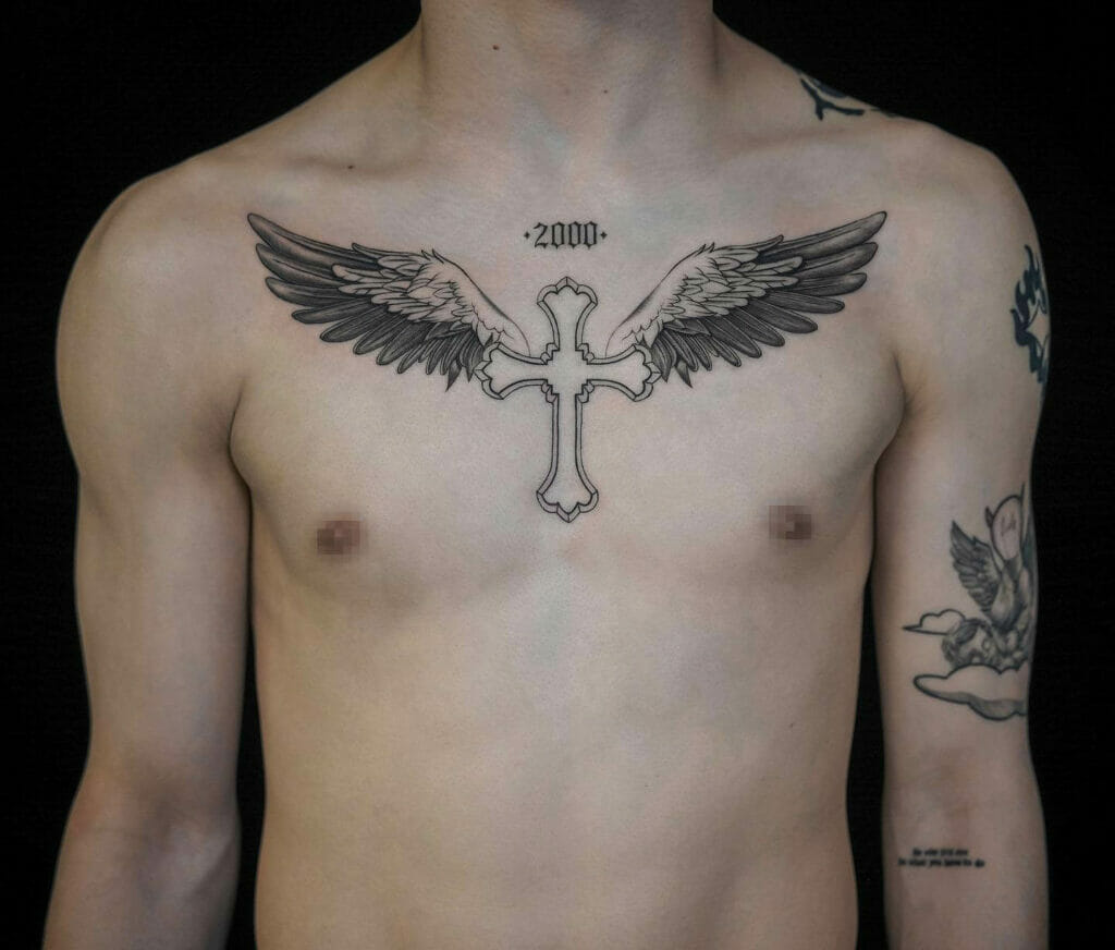 Cross With Wings Tattoo On Chest